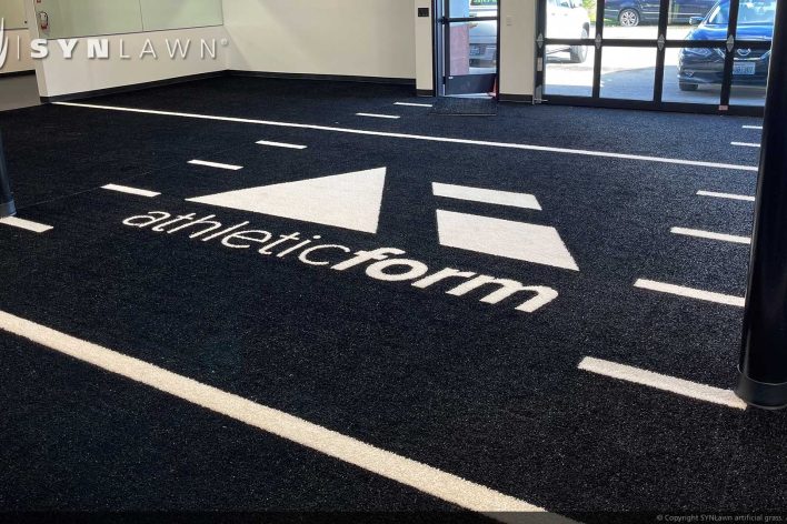 image of SYNLawn Honolulu HI prefab turf logos for athletic weight room applications